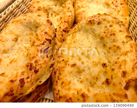 Warm, cheesy bread fresh from the oven at a bustling bakery Warm, cheesy bread fresh from the oven at a bustling bakery 139090499