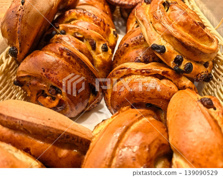 Delicious fresh pastries waiting to be enjoyed at a charming bakery Delicious fresh pastries waiting to be enjoyed at a charming bakery 139090529