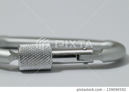 Close-up of a carabiner with a large margin Close-up of a carabiner with a large margin 139090592