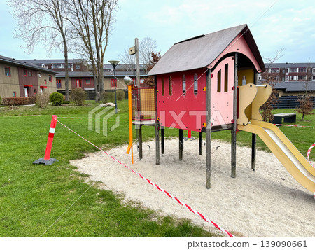 Closed playground with barrier tape and warning cones Closed playground with barrier tape and warning cones 139090661