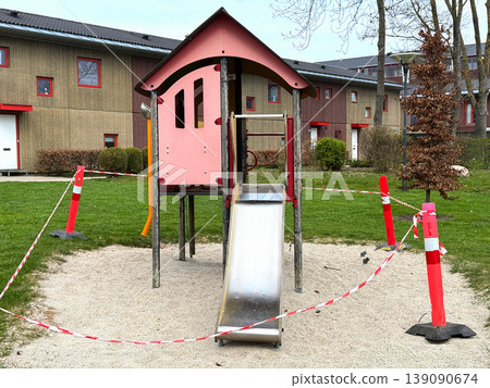 Closed playground with barrier tape and warning cones Closed playground with barrier tape and warning cones 139090674