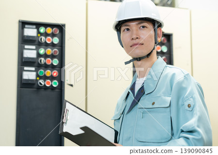 A male engineer performing building maintenance. Filming assistance provided by: Denpa Gakuen Educational Foundation, Tokyo Electronics College. A male engineer performing building maintenance. Filming assistance provided by: Denpa Gakuen Educational Foundation, Tokyo Electronics College. 139090845