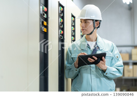 A male engineer performing building maintenance. Filming assistance provided by: Denpa Gakuen Educational Foundation, Tokyo Electronics College. 139090846