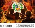 Concept of protests and social unrest in Peru. Silhouette of a crowd facing a burning flag of Peru with raised fists. Political conflict and revolution abstract image 139090985