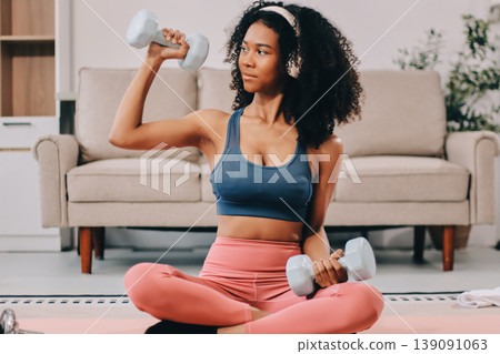 Women exercising in fitness studio yoga classes Women exercising in fitness studio yoga classes 139091063
