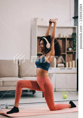 Women exercising in fitness studio yoga classes Women exercising in fitness studio yoga classes 139091064