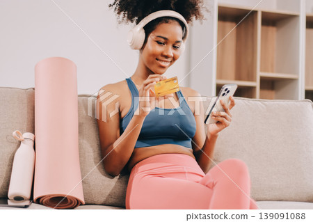 Women exercising in fitness studio yoga classes Women exercising in fitness studio yoga classes 139091088