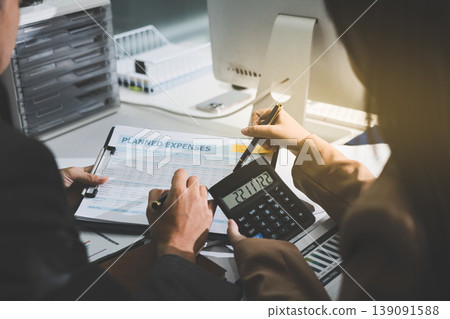 Accounting company provide finance and taxation planning for profitable cash flow, Auditor accountant working in office, analyze financial data and accounting record with calculator Accounting company provide finance and taxation planning for profitable cash flow, Auditor accountant working in office, analyze financial data and accounting record with calculator 139091588