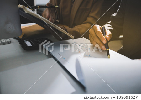 Accounting company provide finance and taxation planning for profitable cash flow, Auditor accountant working in office, analyze financial data and accounting record with calculator 139091627