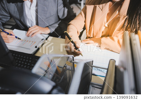 Accounting company provide finance and taxation planning for profitable cash flow, Auditor accountant working in office, analyze financial data and accounting record with calculator Accounting company provide finance and taxation planning for profitable cash flow, Auditor accountant working in office, analyze financial data and accounting record with calculator 139091632