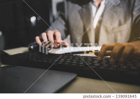 Accounting company provide finance and taxation planning for profitable cash flow, Auditor accountant working in office, analyze financial data and accounting record with calculator Accounting company provide finance and taxation planning for profitable cash flow, Auditor accountant working in office, analyze financial data and accounting record with calculator 139091645
