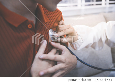 Doctor using a stethoscope checking patient with examining, presenting results symptom and recommend treatment method, Healthcare and medical concept Doctor using a stethoscope checking patient with examining, presenting results symptom and recommend treatment method, Healthcare and medical concept 139091654