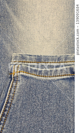Close-up texture of blue stonewashed jeans Close-up texture of blue stonewashed jeans 139091684