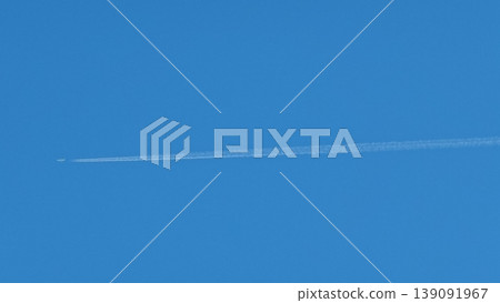 An airplane cloud extending into the blue sky An airplane cloud extending into the blue sky 139091967