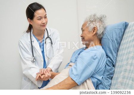 Asian doctor checking and treat elderly woman patient health in hospital. Asian doctor checking and treat elderly woman patient health in hospital. 139092236