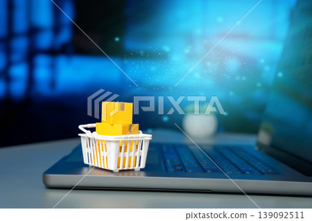 parcels in a shopping bag on a laptop keyboard. Concept of online shopping, e-commerce, parcel delivery, internet purchases, and modern digital retail parcels in a shopping bag on a laptop keyboard. Concept of online shopping, e-commerce, parcel delivery, internet purchases, and modern digital retail 139092511