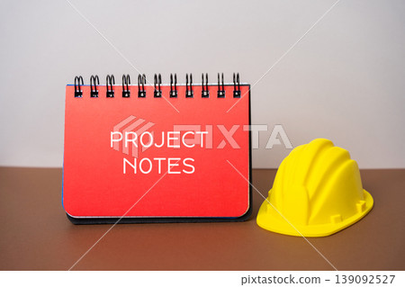 Project notes concept. Notebook with ideas, planning, tasks, and reminders, business organization, workflow, and productivity for office, management, and creative projects. Construction helmet 139092527