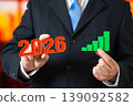 2026 year business growth. businessman holding rising graph showing success, revenue increase 139092582