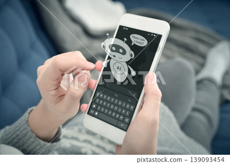AI assistant chatbot on smartphone screen, woman using mobile phone at home. Virtual support concept. AI assistant chatbot on smartphone screen, woman using mobile phone at home. Virtual support concept. 139093454