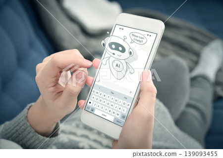 Cute AI assistant chatbot on smartphone screen, woman using mobile phone at home. Virtual support concept. Cute AI assistant chatbot on smartphone screen, woman using mobile phone at home. Virtual support concept. 139093455