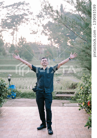Casual portrait of man in agricultural field during daytime Casual portrait of man in agricultural field during daytime 139093599