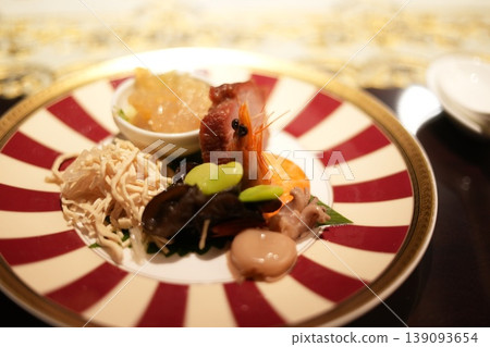Enjoy exquisite Chinese cuisine at a restaurant; a delightful dining experience in a tourist destination. Enjoy exquisite Chinese cuisine at a restaurant; a delightful dining experience in a tourist destination. 139093654