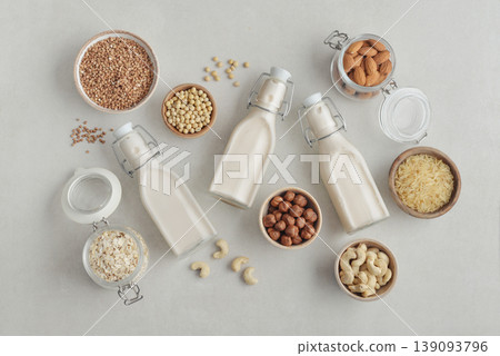 bottles with vegan milk on concrete a kitchen table bottles with vegan milk on concrete a kitchen table 139093796