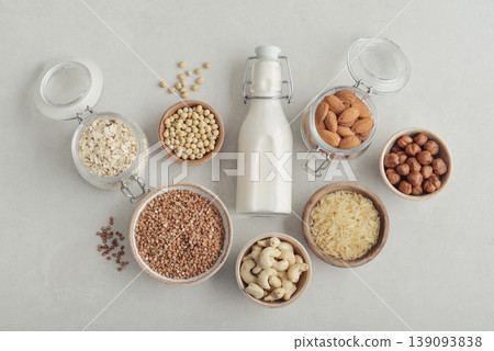 bottles with vegan milk on concrete a kitchen table bottles with vegan milk on concrete a kitchen table 139093838