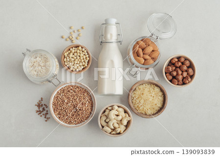 bottles with vegan milk on concrete a kitchen table bottles with vegan milk on concrete a kitchen table 139093839