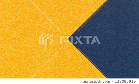 Textured yellow paper background with dark blue arrow, macro. Template with copy space for banner, presentation 139093919