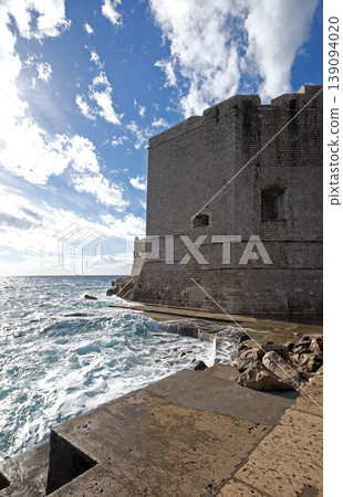 Defense walls of the old town of Dubrovnik, a well-preserved medieval fortress and a popular tourist destination, Croatia Defense walls of the old town of Dubrovnik, a well-preserved medieval fortress and a popular tourist destination, Croatia 139094020