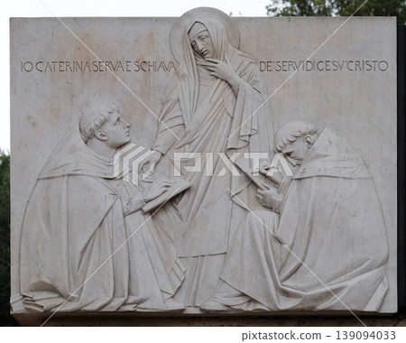 Relief of Saint Catherine of Siena near Sant Angelo Castle in Rome, Italy Relief of Saint Catherine of Siena near Sant Angelo Castle in Rome, Italy 139094033