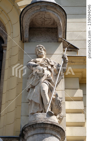 Saint John the Evangelist on the portal of Saint James church in Ljubljana, Slovenia Saint John the Evangelist on the portal of Saint James church in Ljubljana, Slovenia 139094046