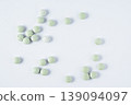 Kelp iodine tablets on white background. Natural supplement for thyroid support, iodine source, and healthy metabolism concept. 139094097
