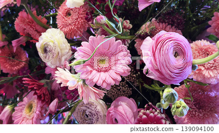 Background of mixed gerbera flowers in various colors. Bright gerbera floral composition with fresh petals and vibrant natural beauty. 139094100