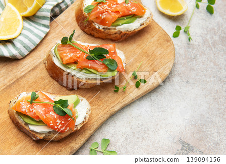 Smoked salmon toast with avocado and cream cheese 139094156