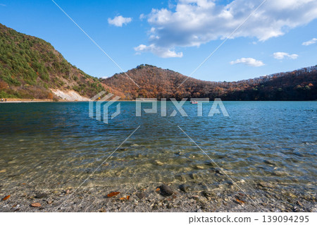 The scenery of Katanuma Lake: The cobalt blue surface of the caldera lake. 139094295