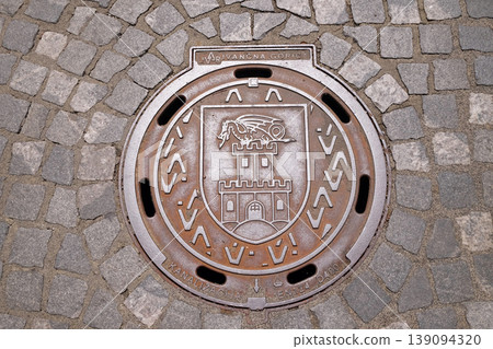 Hatch cover with the coat of arms of Ljubljana, Slovenia 139094320