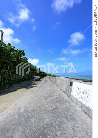 The refreshing scenery of Shiraho Beach, with its blue sky and coastal road. The refreshing scenery of Shiraho Beach, with its blue sky and coastal road. 139094417