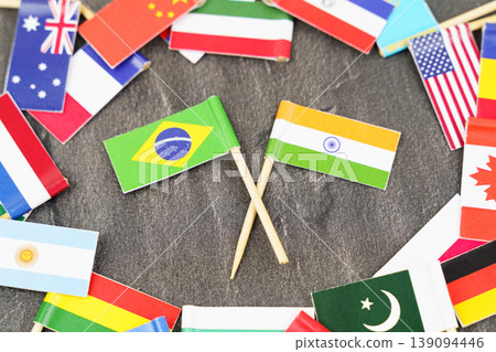 The concept is diplomacy. In the middle among the various flags are two flags - India, Brazil The concept is diplomacy. In the middle among the various flags are two flags - India, Brazil 139094446