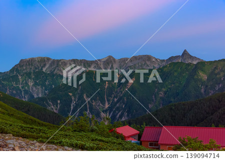 The Northern Alps: The Yari-Hotaka mountain range bathed in the morning glow, with a clear dawn sky and sharp ridgelines. The Northern Alps: The Yari-Hotaka mountain range bathed in the morning glow, with a clear dawn sky and sharp ridgelines. 139094714
