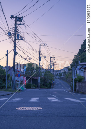 A quiet residential area bathed in the morning light; a view of a local street. A quiet residential area bathed in the morning light; a view of a local street. 139095471