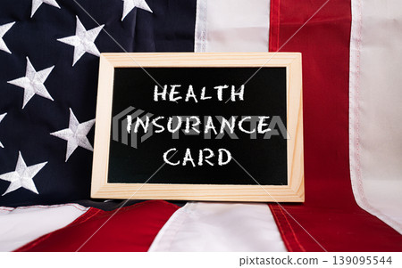 Health Insurance Card chalkboard sign on American flag background. USA healthcare insurance policy reform concept Health Insurance Card chalkboard sign on American flag background. USA healthcare insurance policy reform concept 139095544
