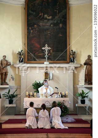 Priest celebrating Mass for pilgrims in the Catholic Church Saint Jerome in Herceg Novi, Montenegro Priest celebrating Mass for pilgrims in the Catholic Church Saint Jerome in Herceg Novi, Montenegro 139096022