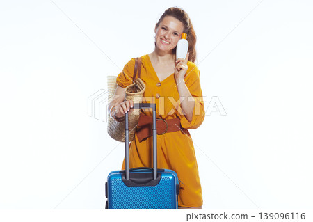 Happy Vacationer Holding Sunscreen Bottle with Suitcase Happy Vacationer Holding Sunscreen Bottle with Suitcase 139096116