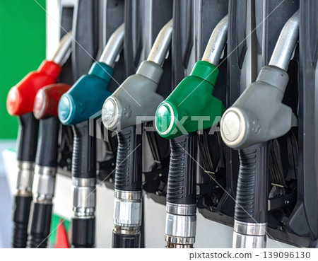 Fuel nozzles line up in a petrol station dispenser 139096130