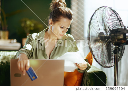 Woman Addressing Financial Worries at Home Woman Addressing Financial Worries at Home 139096304