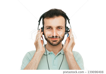 Hearing test, hearing diagnostic. A man wearing headphones having an audiometry test isolated in white 139096408