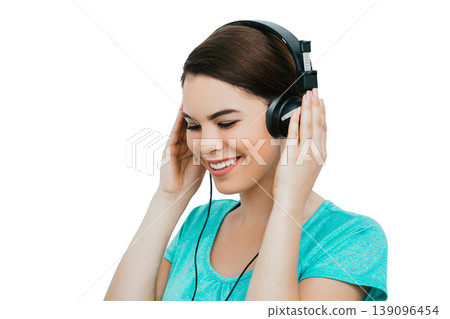 Audiometry, hearing exam. Positive Hispanic woman wearing special headphones getting a hearing diagnostic. Check-up your hear 139096454