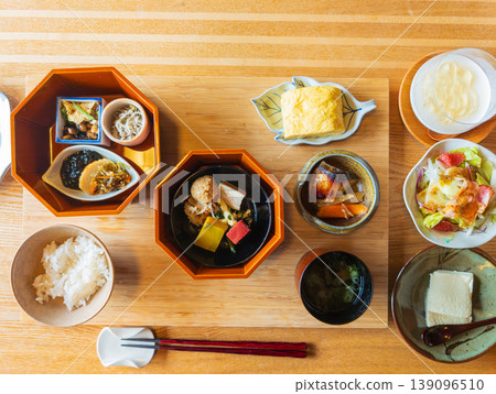 A colorful Japanese breakfast spread on a wooden table. A colorful Japanese breakfast spread on a wooden table. 139096510